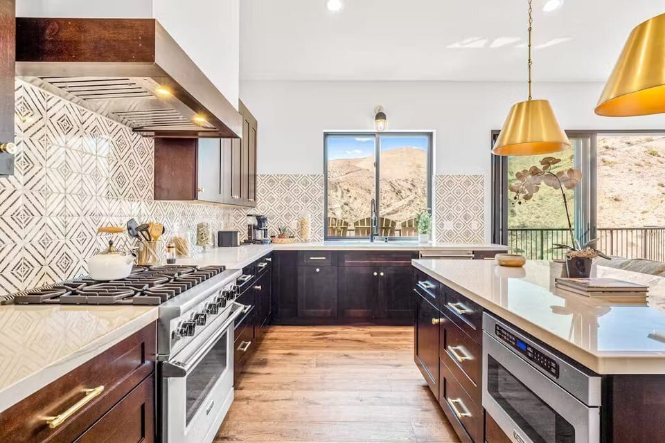 Kitchen features cooking basics and stainless steel appliances. 