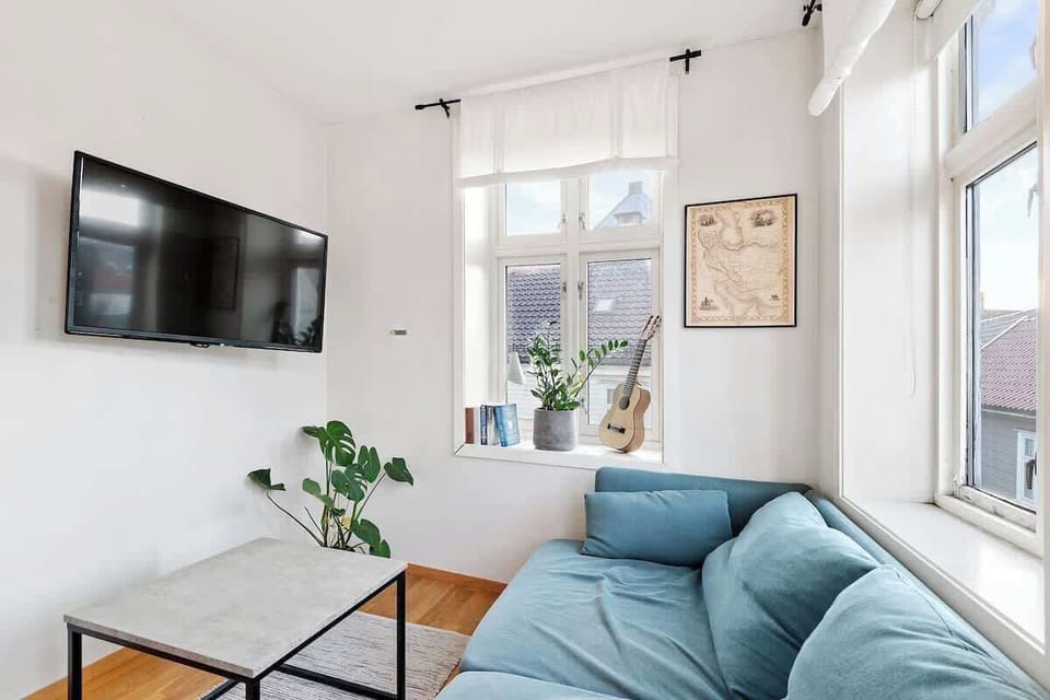 The apartment is small, but still has a living room big enough to enjoy cozy evenings at home. 

Stream your favourite series and movies with the Chromecast connected to the TV.

Or just enjoy the beautiful fairytailish view from the windows!
