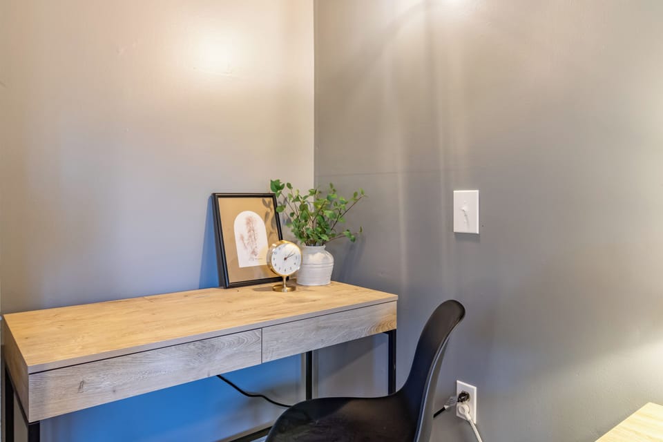 Dedicated workspace with a desk that has plugs for your devices