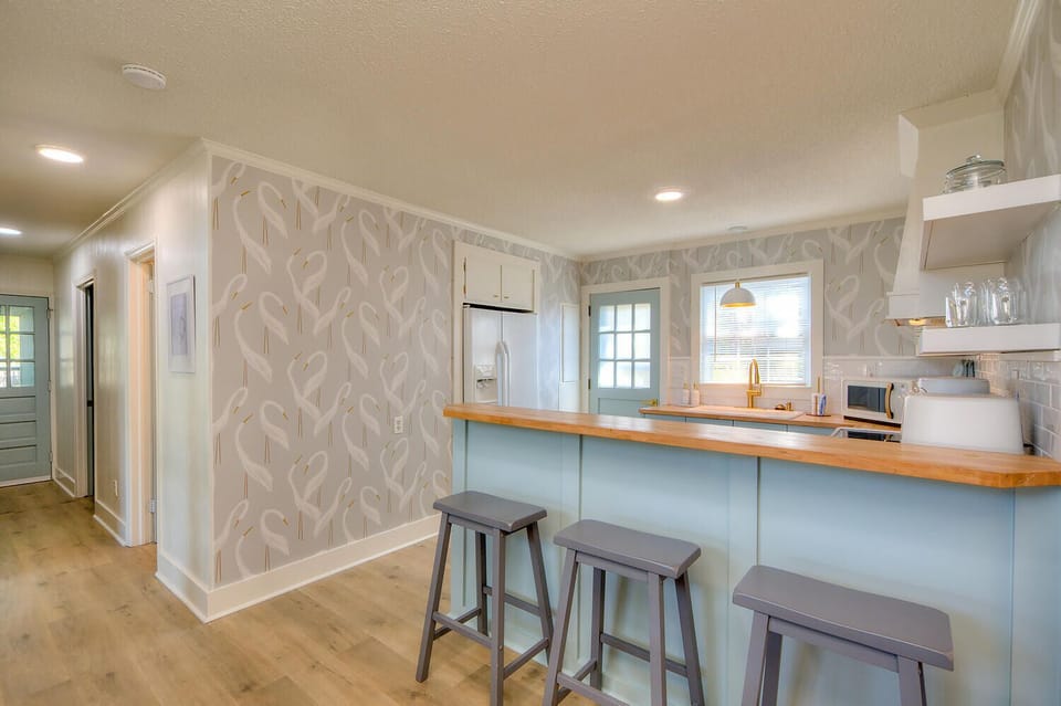 Kitchen counter seating for 3 guests.