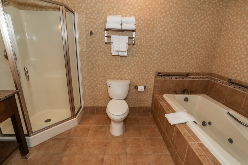 Elegant bathroom with a spacious walk-in shower and classic vanity for a refreshing experience.