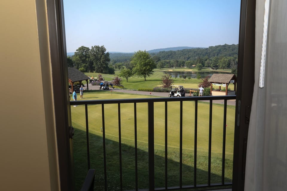 Enjoy serene views of the golf course right from your private balcony.
