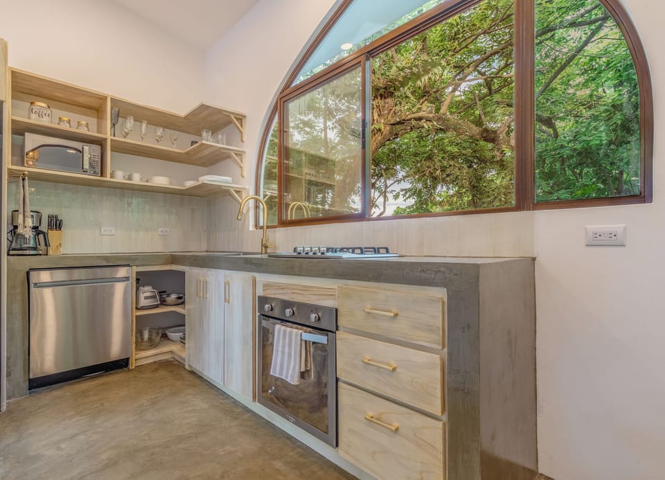 Full kitchen with dishwasher, microwave, and more.