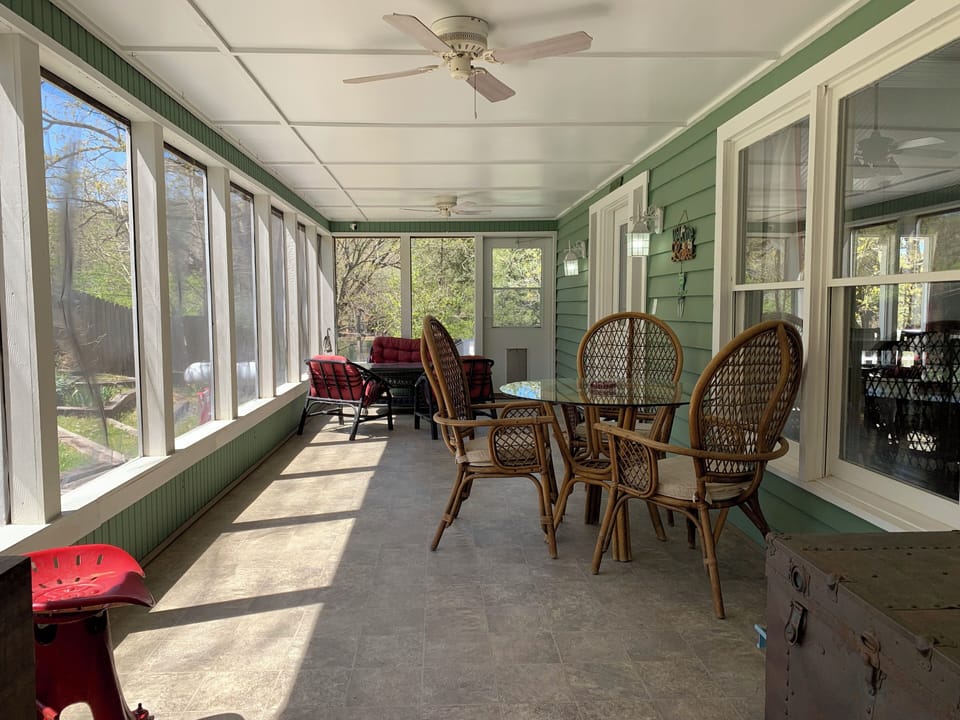 Large screened porch for rainy days. This is the entrance to the house.