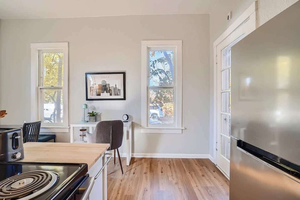 The many windows give great lighting for those utilizing the desk and working from home