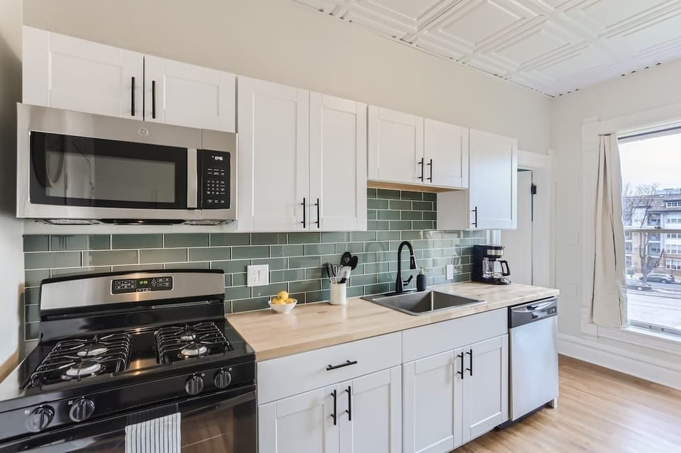 Light oak and white cabinetry are one of the many highlights of this kitchen