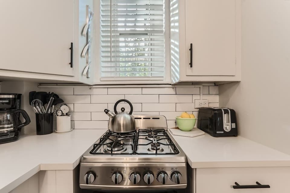 Newly remodeled kitchen has all new appliances and utensils 