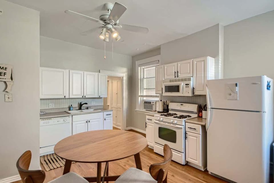 Natural lighting complements the historic comforts from this kitchen and dining space