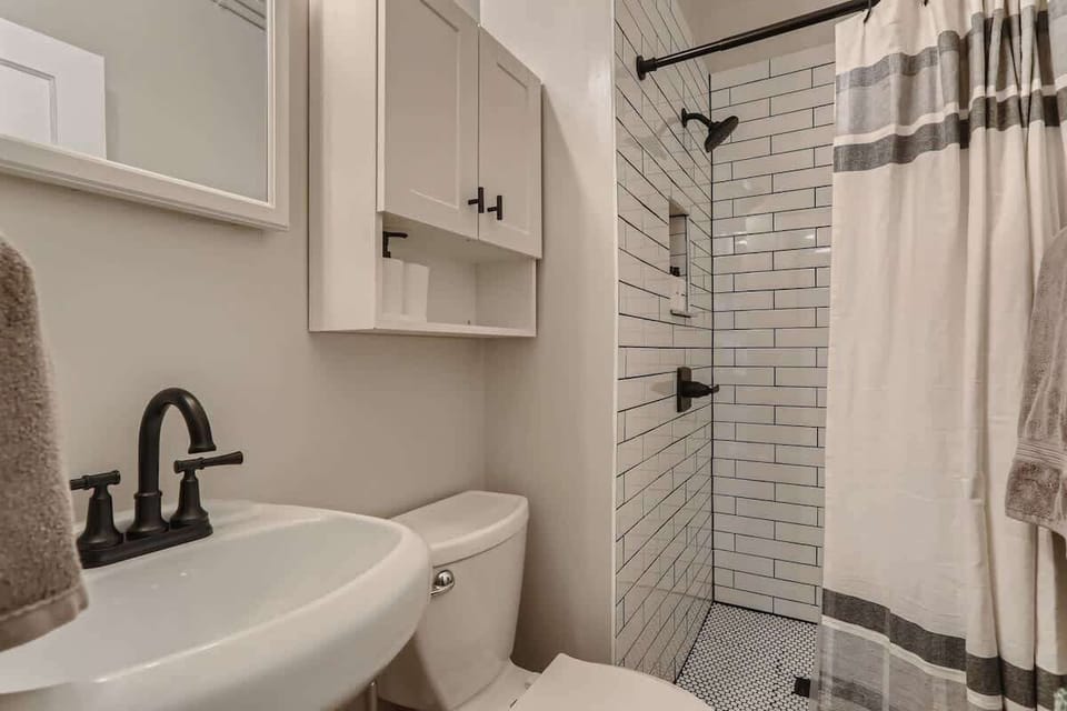 Newly remodeled bathroom provides all the modern comforts in this historic home