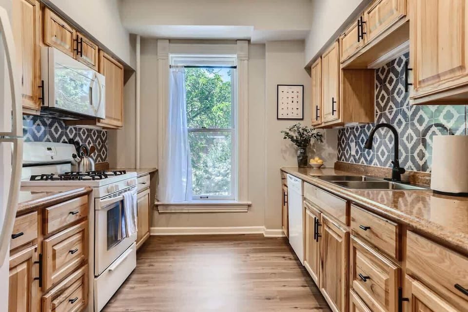 Beautiful wood kitchen with granite countertops has newly updated appliances 