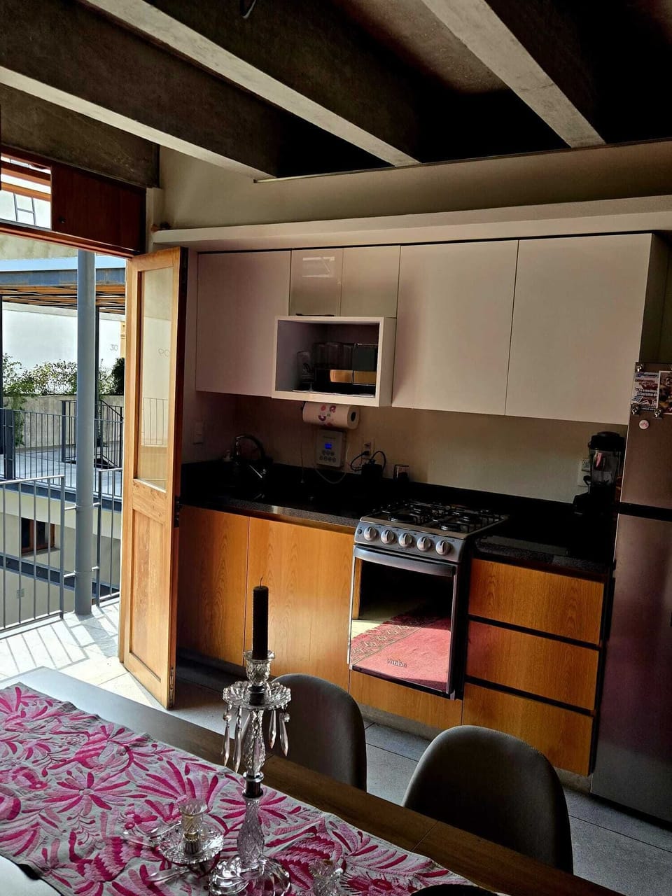 Entrance into Kitchen & Dining area with futon reading nook. Futon converts.
