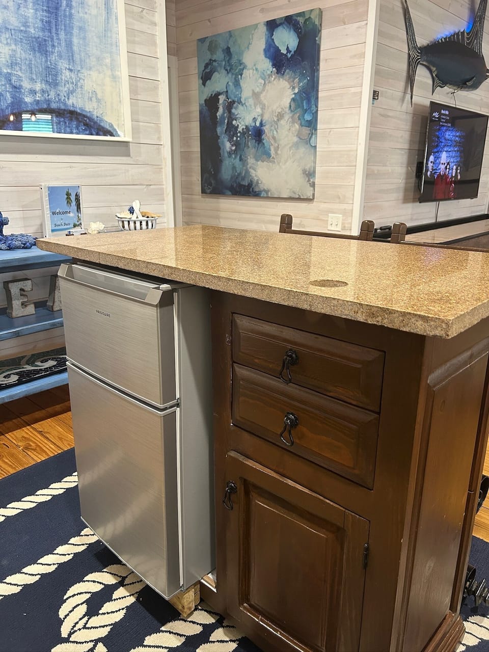 Separate mini fridge and freezer at the bar