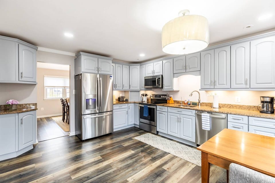 The gourmet kitchen was recently upgraded with all stainless steel appliances.