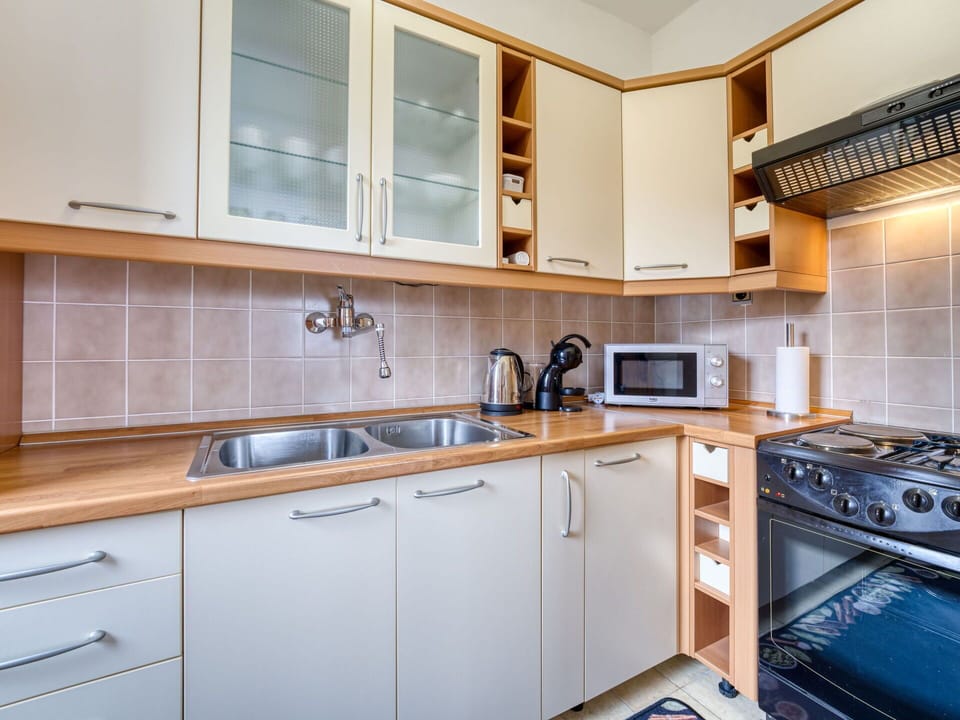 Kitchen, Kitchen Appliance, Countertop, Cabinetry, Major Appliance, Wood, Furniture, Interior Design, Flooring, Plumbing Fixture