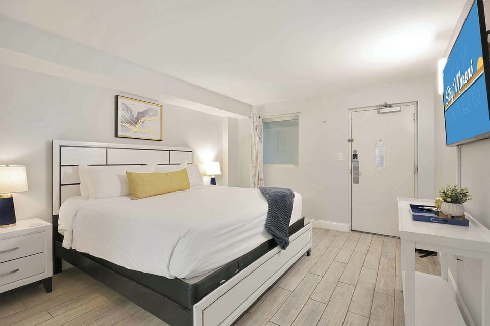 Rest easy in this modern and inviting bedroom featuring a plush king bed, stylish décor, and smart TV. The perfect place to recharge after a fun-filled day exploring Myrtle Beach’s sun, sand, and sights!