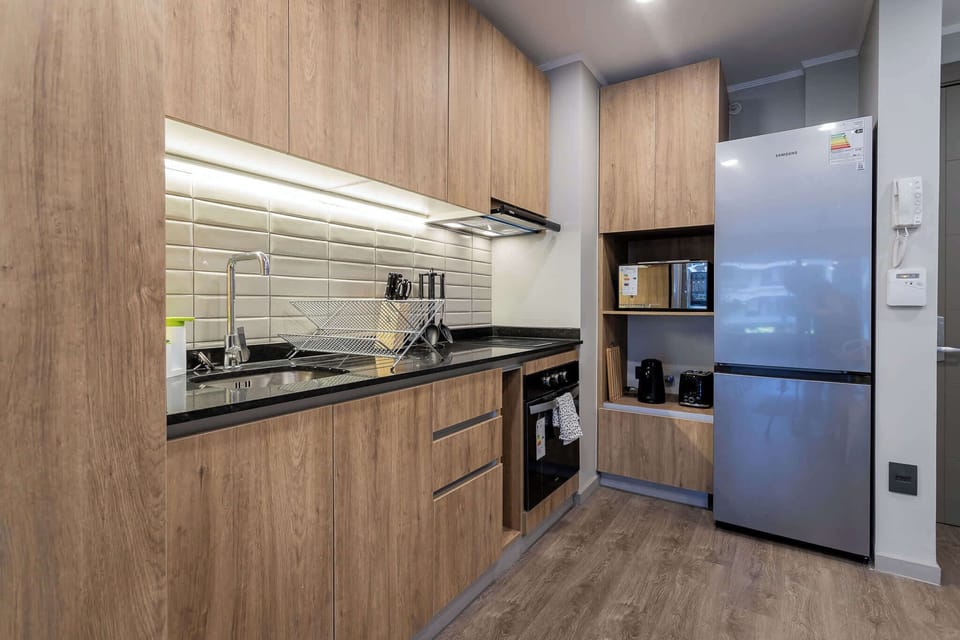 Sleek and modern kitchen with all the essentials for a perfect culinary experience.