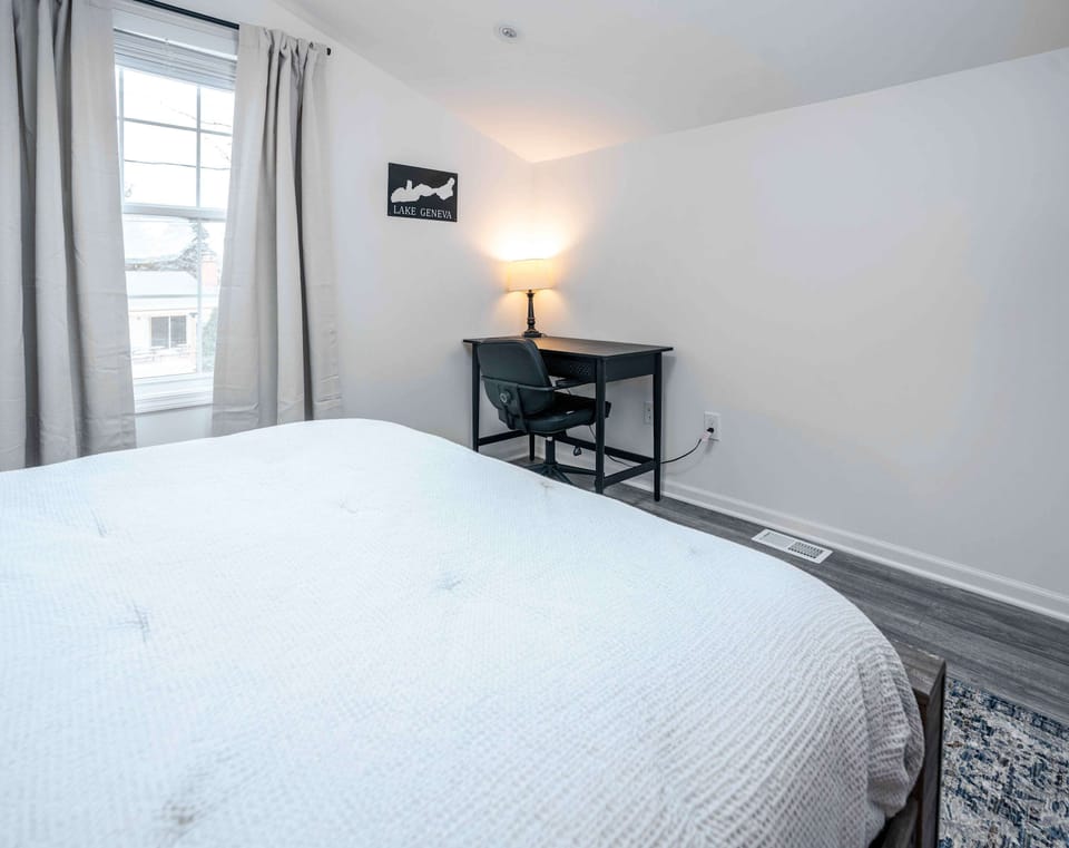 The first bedroom retreat features a plush queen bed & ensuite bath