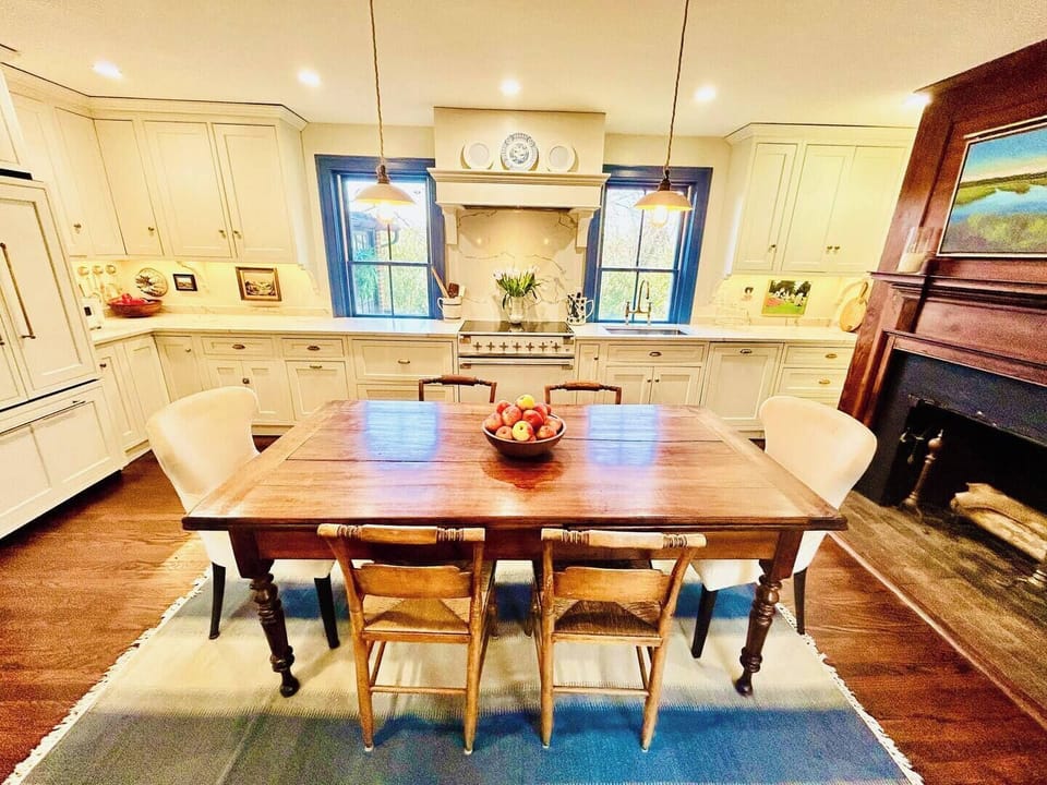 Gourmet kitchen features an AGA induction range and other high-end appliances.
