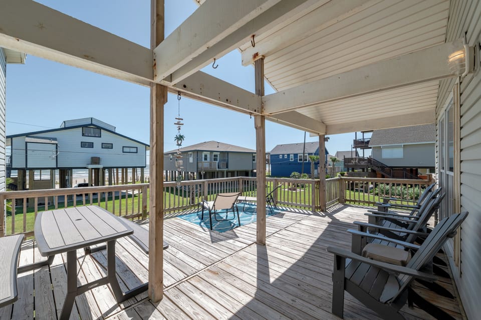 Great size deck to eat outside, soak up some sun or sit back under the cover.