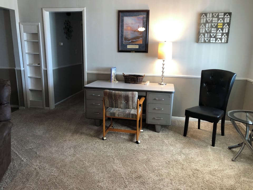 Great work space, sturdy desk, opposite wall has the TV in living rm.