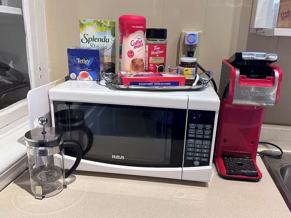 A small microwave for convenience, plus a coffee and tea station.