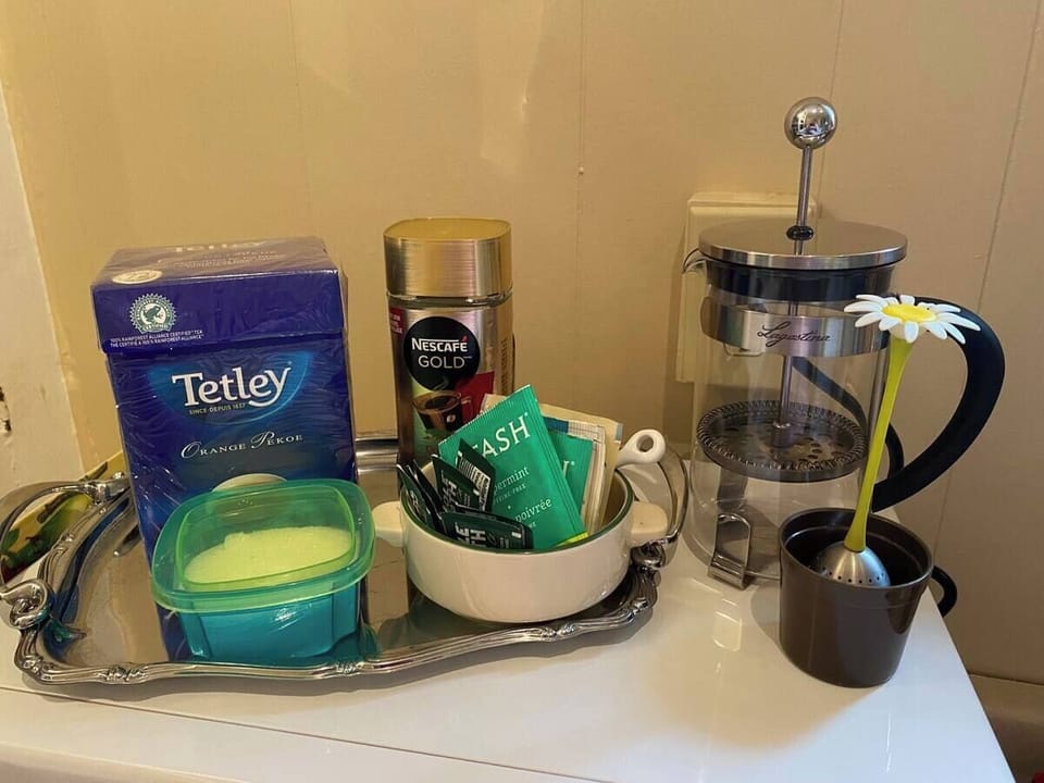 Instant coffee, tea, sugar + creamer, plus a  French press, a Keurig and kettle.