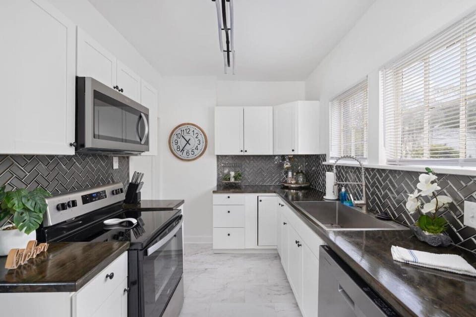 Updated kitchen with new stainless steel appliances.