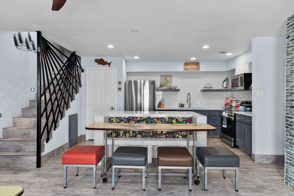Modern kitchen with island seating and stainless steel appliances
