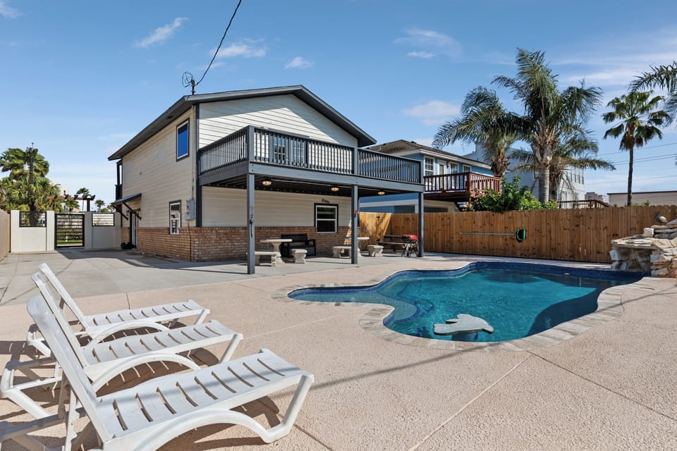 Sparkling private pool with sunny lounging area — your island oasis awaits at 205 W. Saturn (Seascape Villa)!