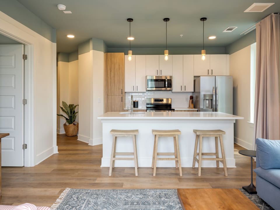 Living room with a sleep sofa and a fully equipped kitchen.