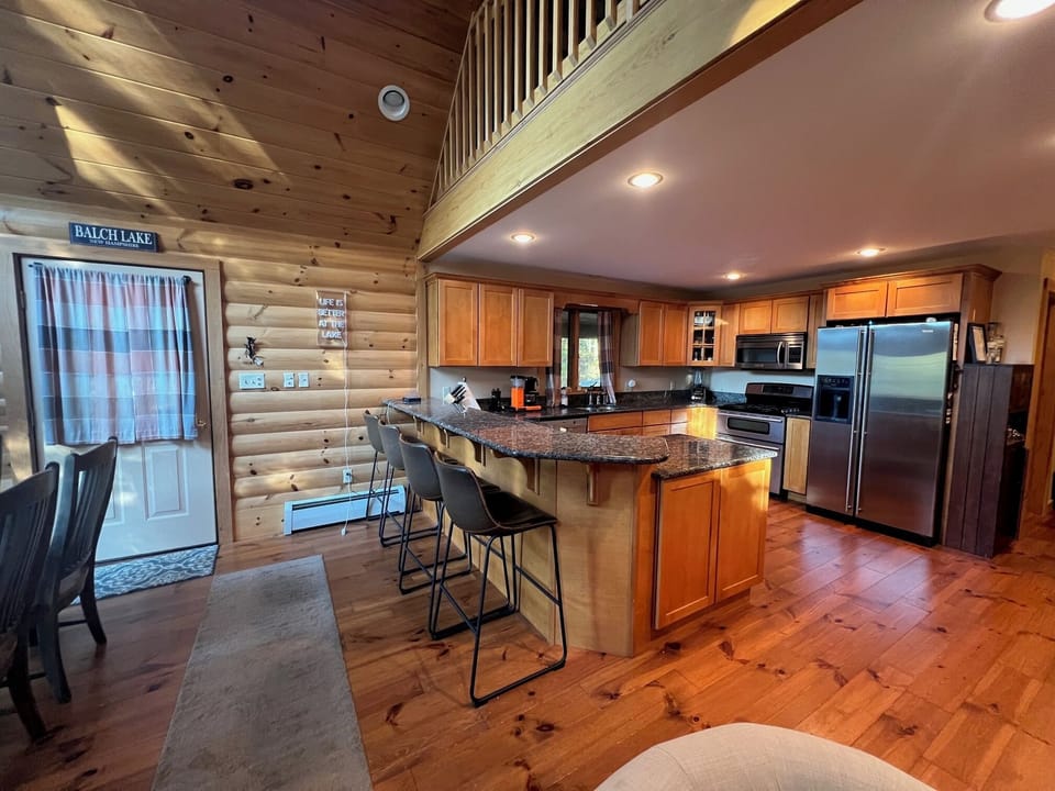 Open concept kitchen, dining, living and loft area 