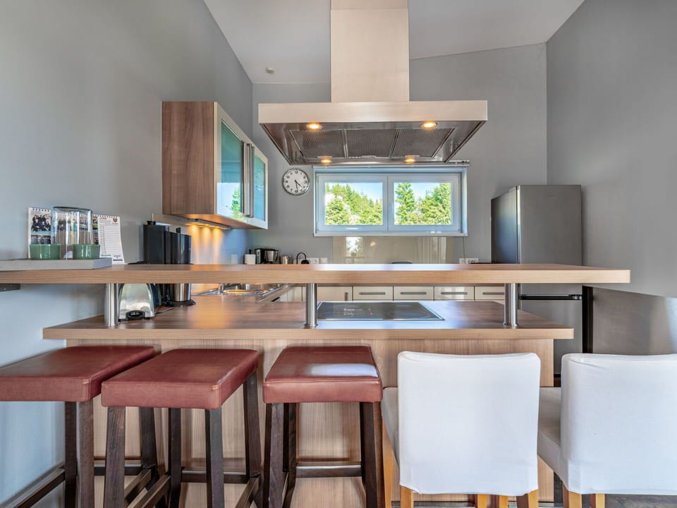 Furniture, Interior Design, Wood, Flooring, Kitchen, Countertop, Light Fixture, Ceiling, Cabinetry, Bar Stool