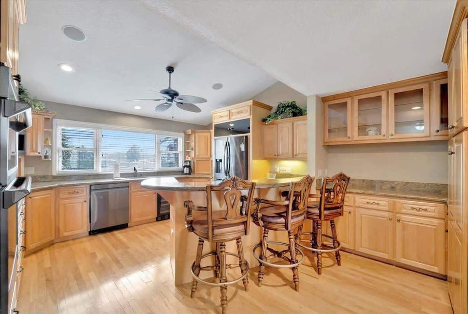 Enjoy coffee at the breakfast bar in our bright and inviting kitchen