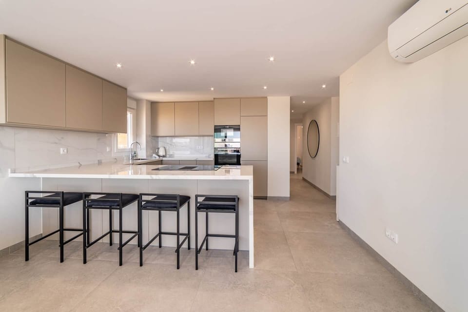 Kitchen with bar chairs