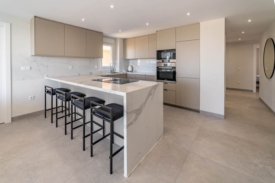 Kitchen with bar chairs