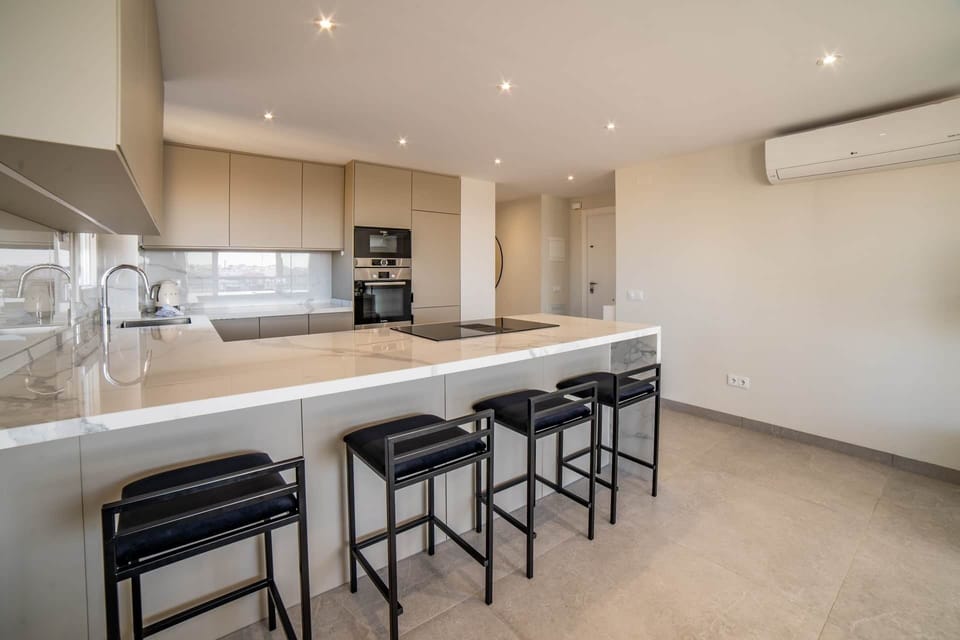Kitchen with bar chairs
