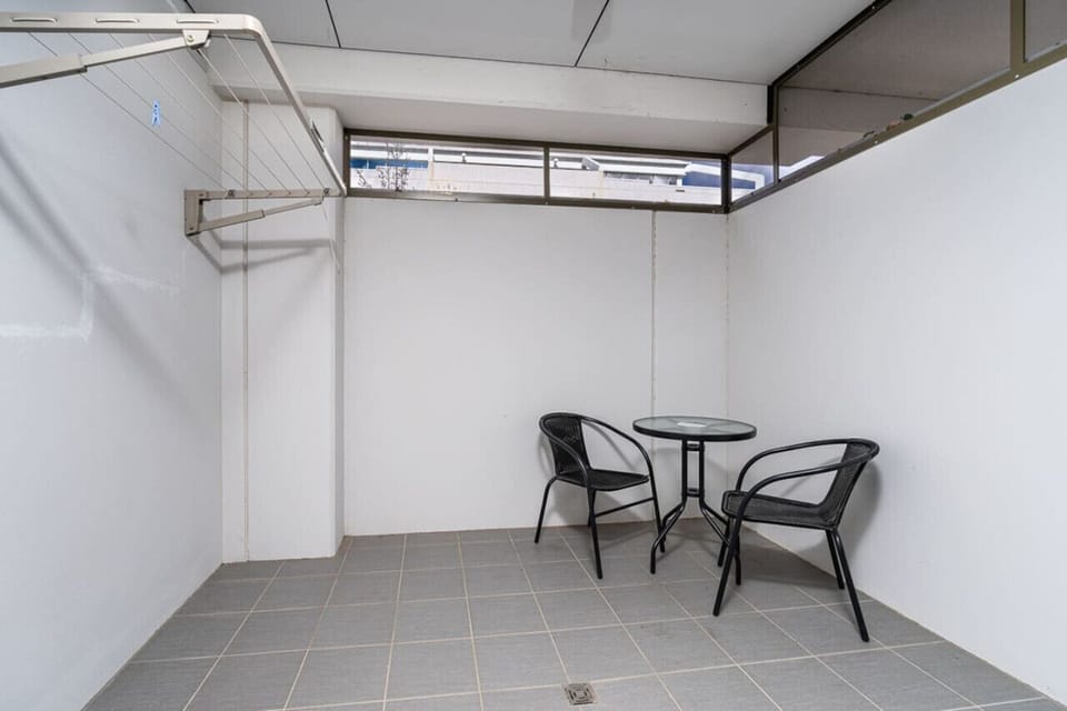 Enjoy a functional space featuring comfortable seating and a convenient clothing line.
