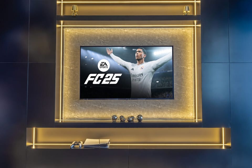 A smart TV featuring FIFA gameplay, perfect for sports enthusiasts seeking entertainment and excitement during their stay in this luxury Downtown Dubai apartment.