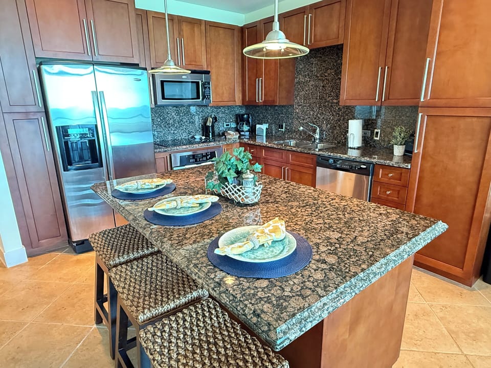 Full oven, electric stove top, microwave and dual sink. 