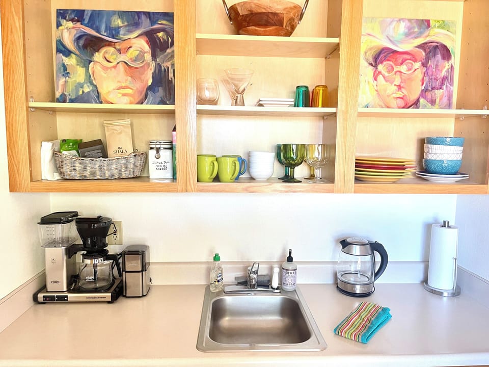 Joshua Tree dark roast coffee & grinder, teas, hot water dispenser. 