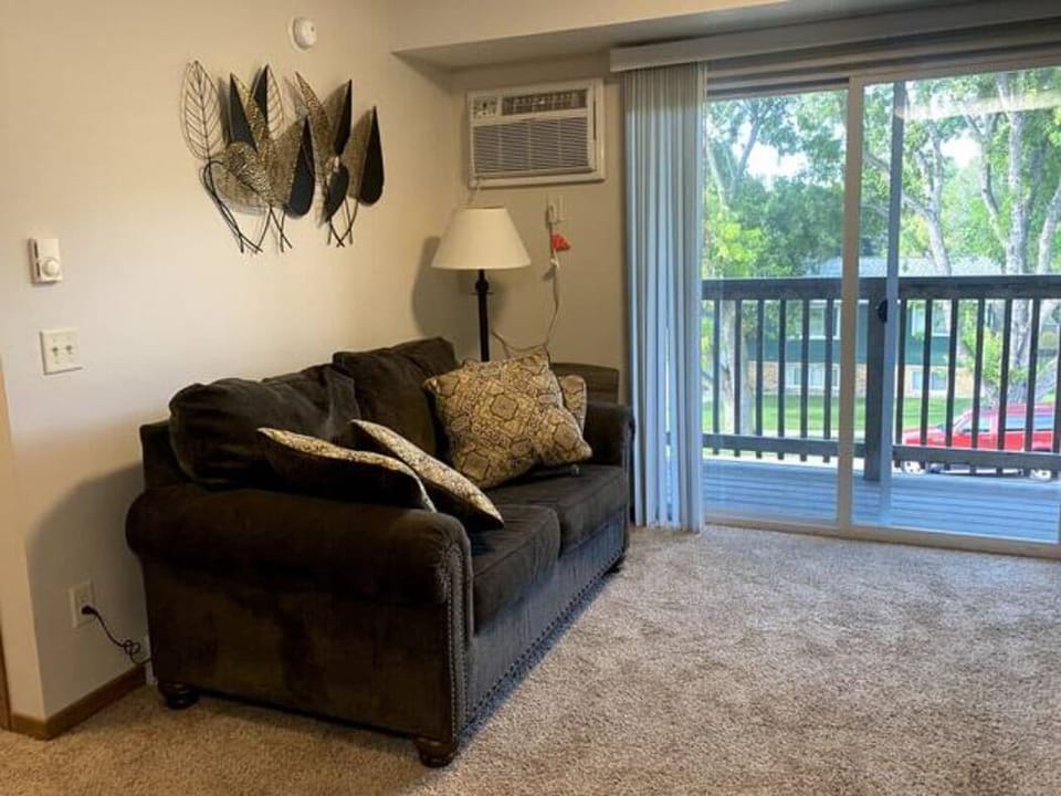 Spacious living room with view out the deck.