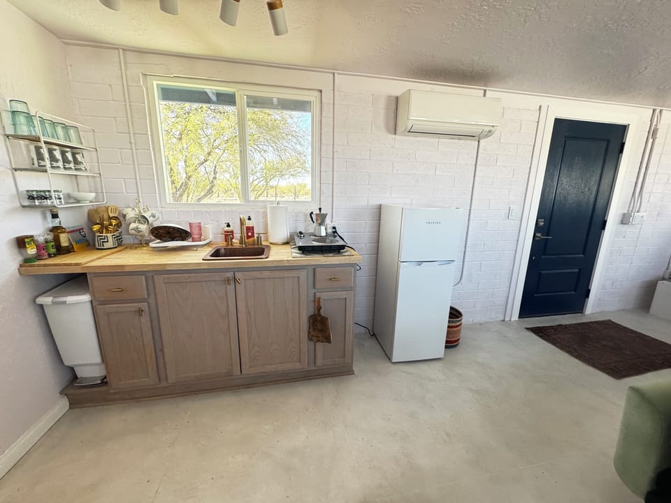 All the necessities for easy meals in our bright kitchenette.