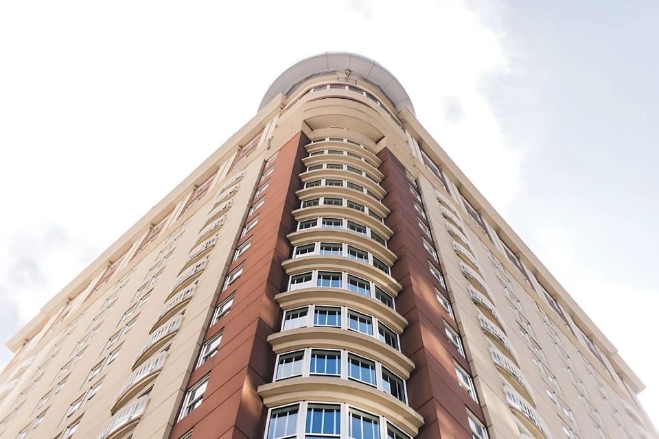 Arrive to a striking tower in the heart of downtown.