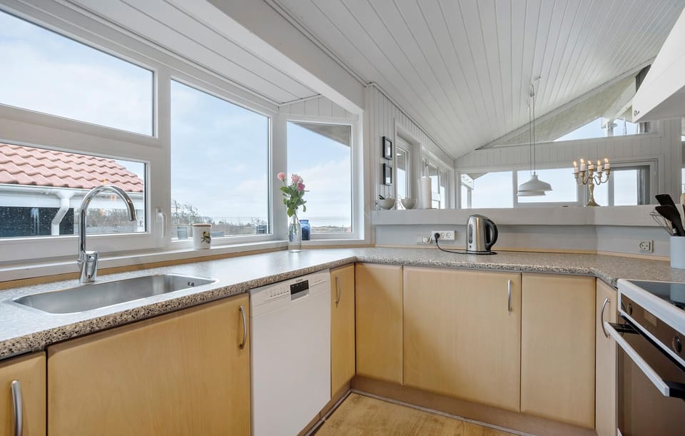 Fridge, stovetop, dishwasher, coffee/tea maker