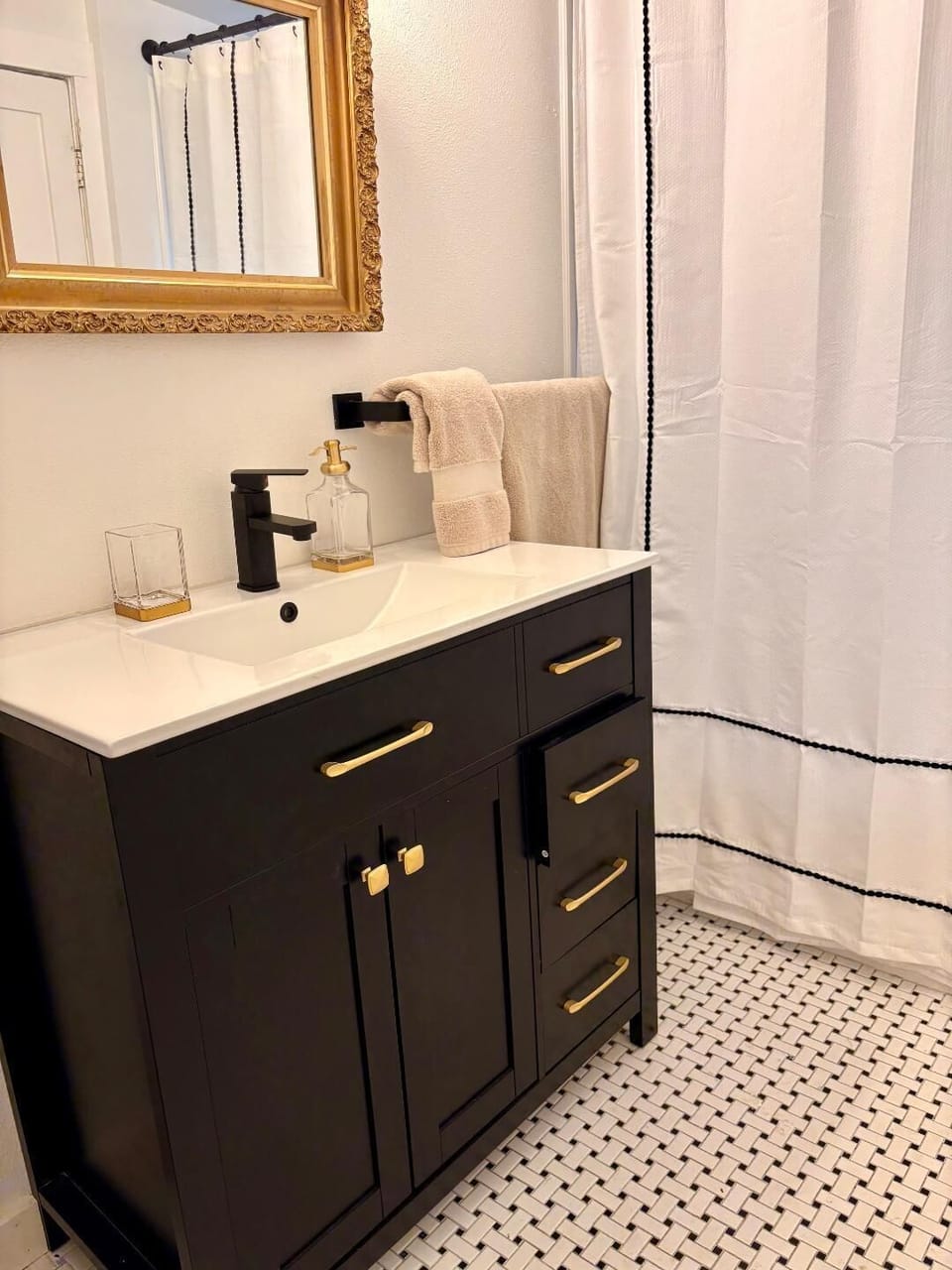 Spa like bathroom with soaps for hair and body provided and plush towels.