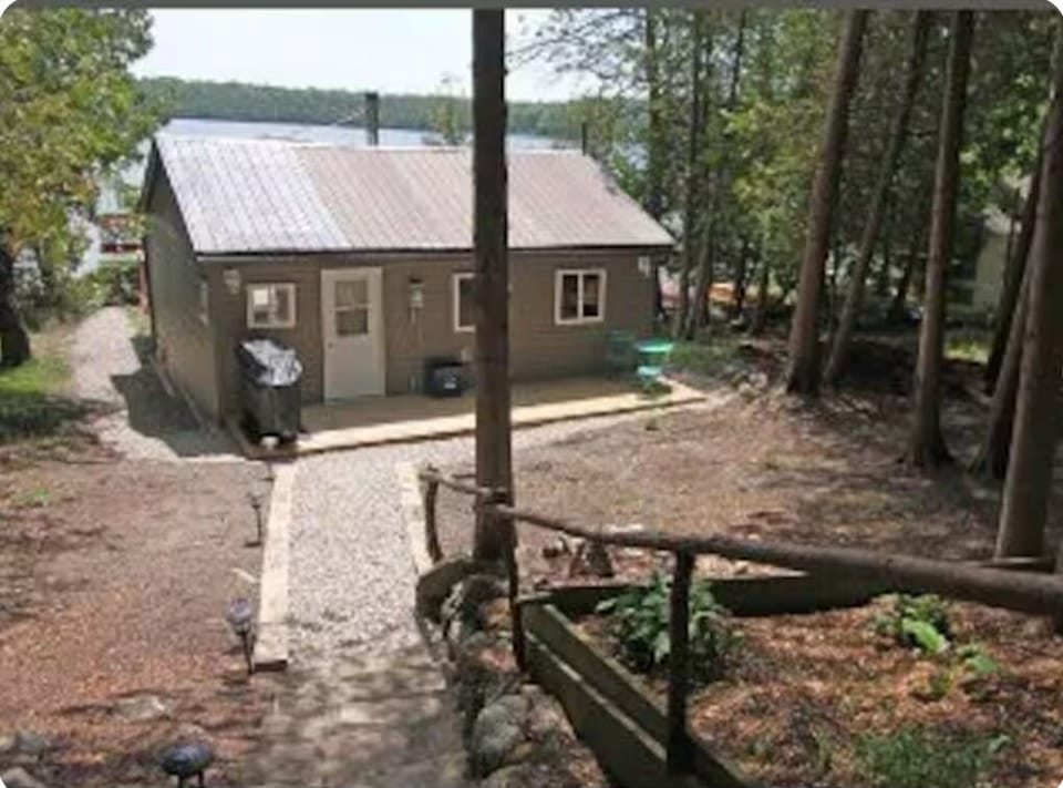 Leading down to cottage entrance. BBQ on deck deck