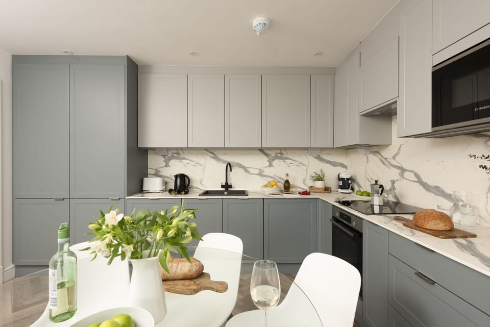 Better view of kitchen appliances, including the sink, microwave, fridge and freezer - 2 Oasis Sands