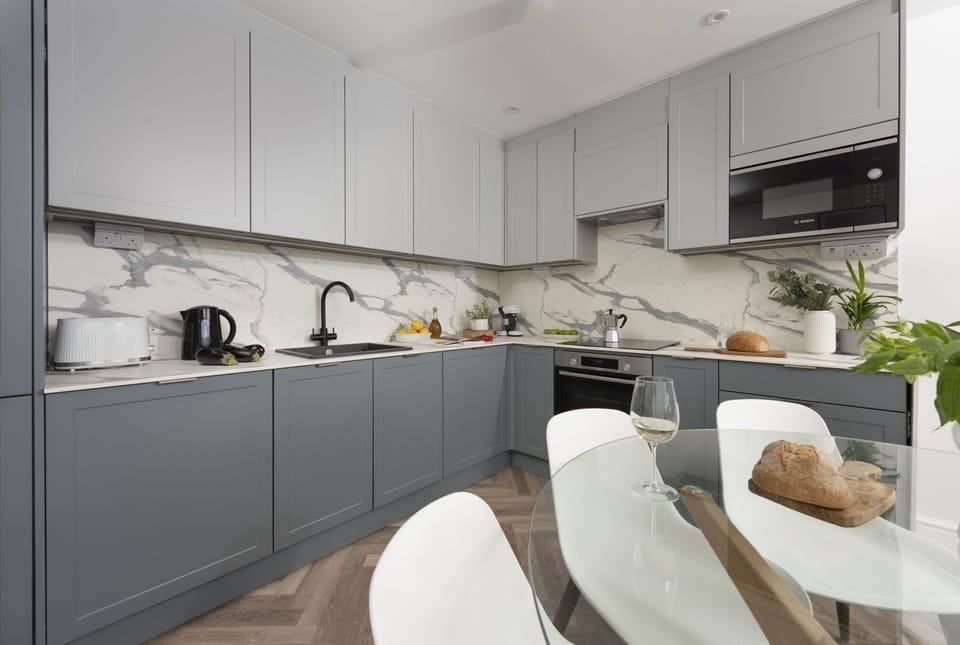 Another view of the kitchen counters, displaying the Microwave, kettle, sink, oven and stove - 2 Oasis Sands