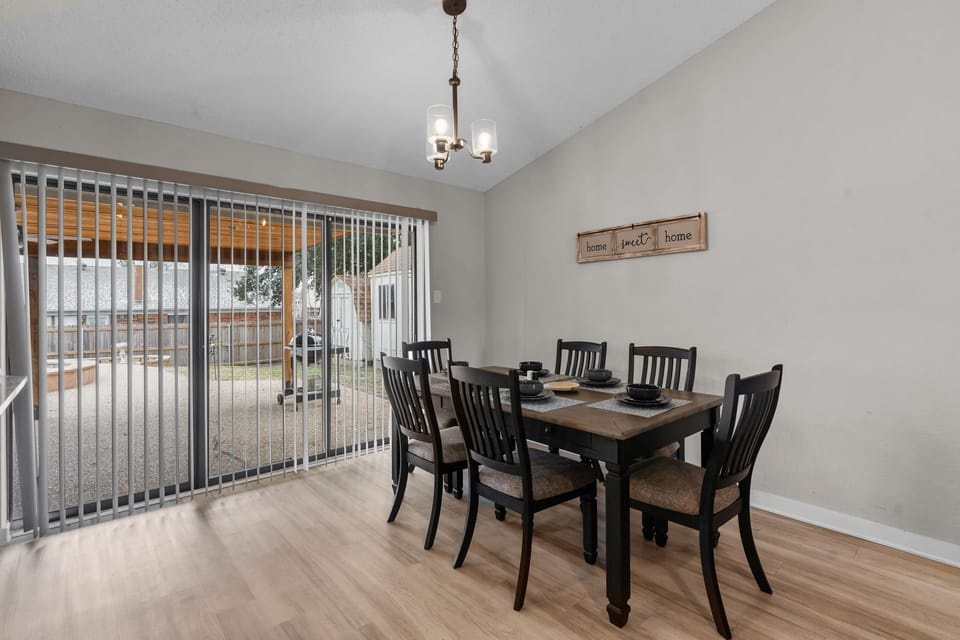 The dining area near the pool area in the backyard.
