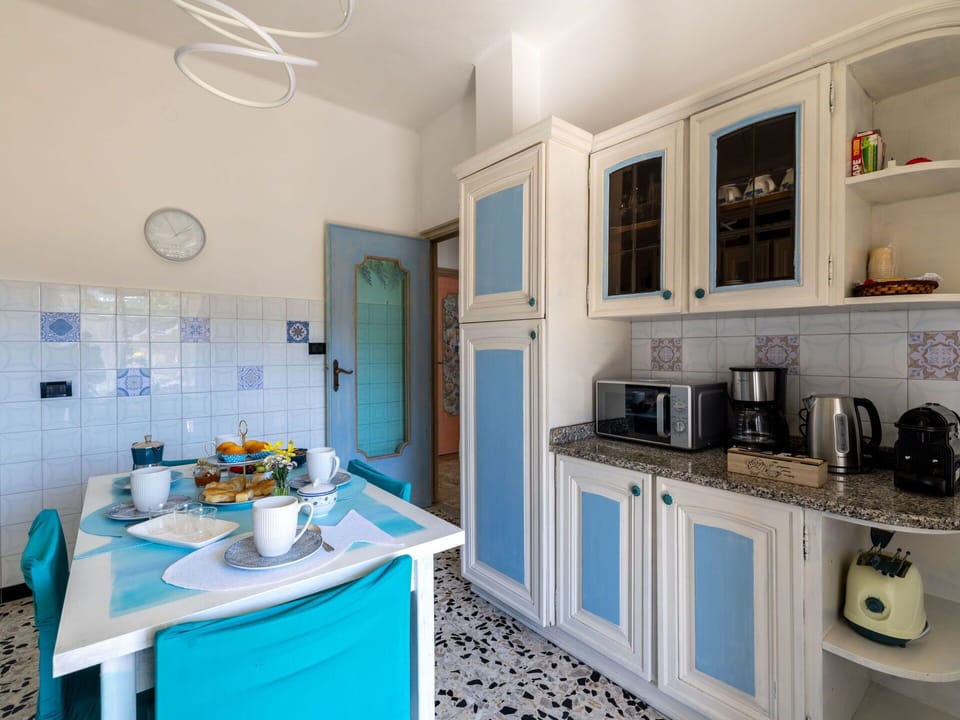 Furniture, Interior Design, Flooring, Floor, Kitchen, Countertop, Lighting, Room, Chair, Major Appliance